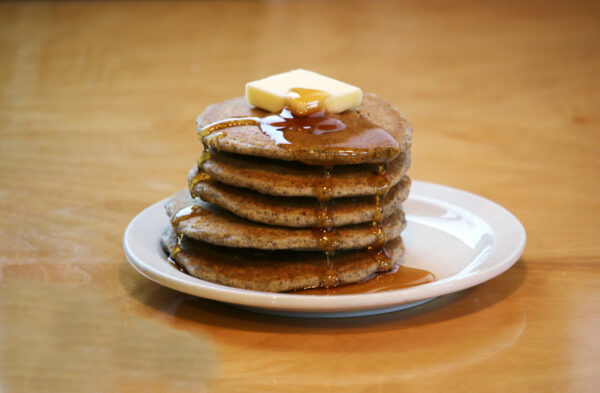 Buckwheat Pancakes made from Polly's Pancake parlor Pancake Mix covered in syrup and butter